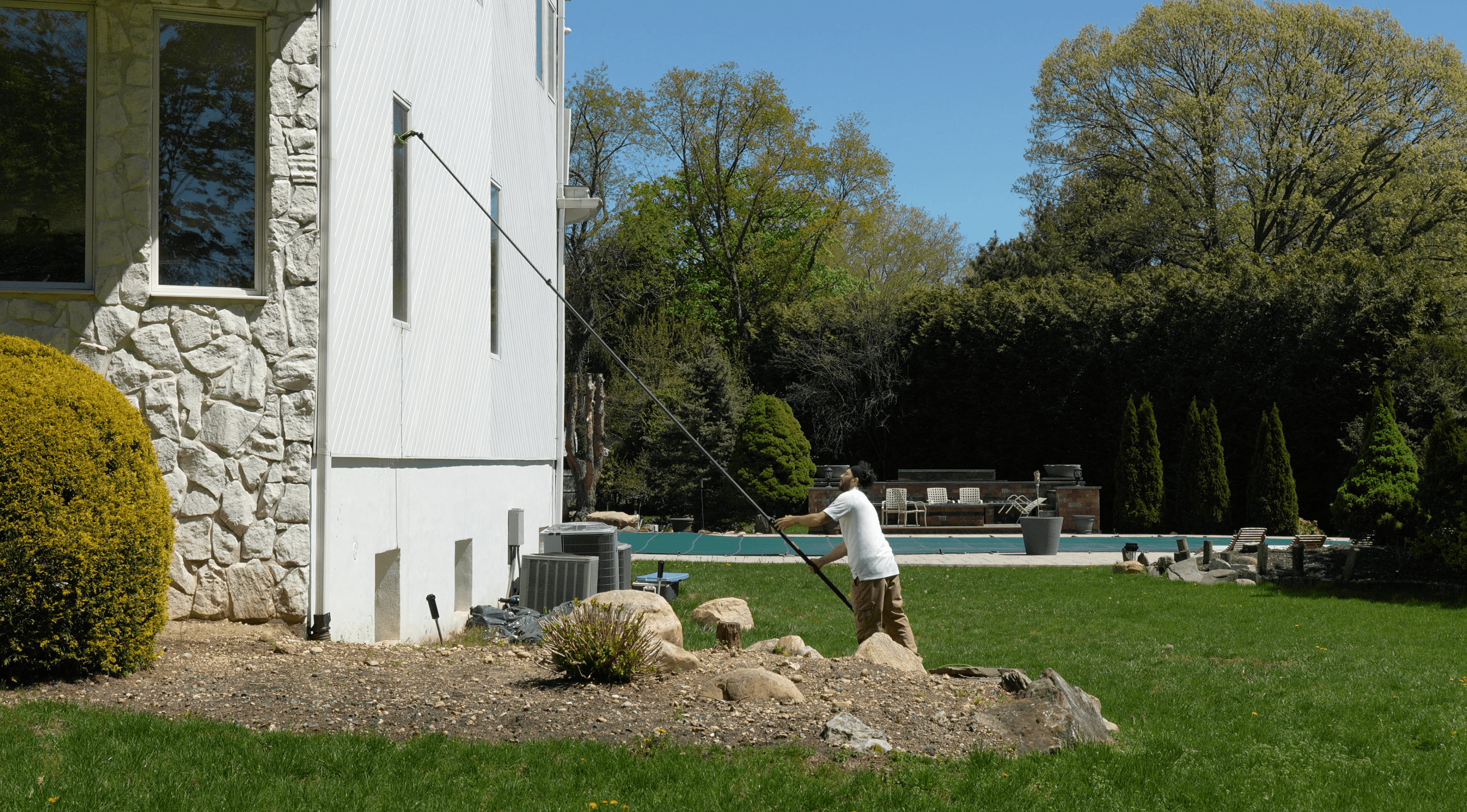 Clearview technician cleaning windows